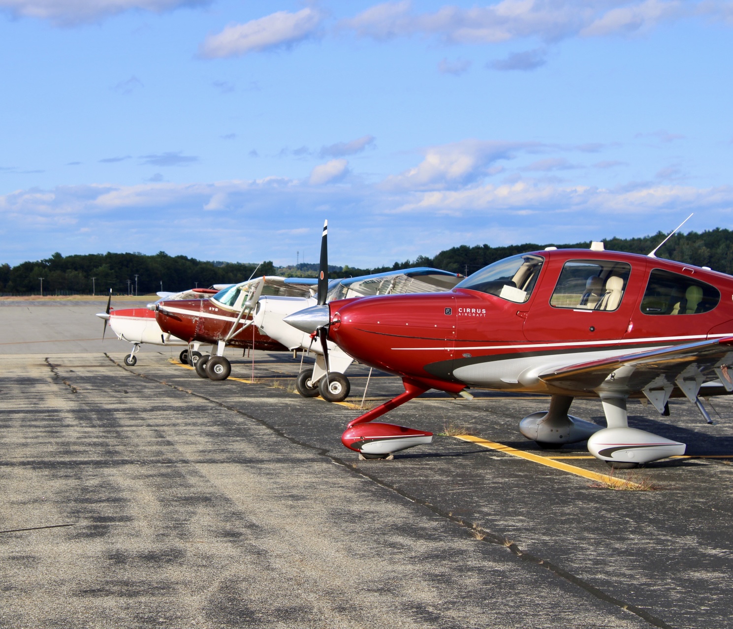 Row of general aviation aircraft on the ramp