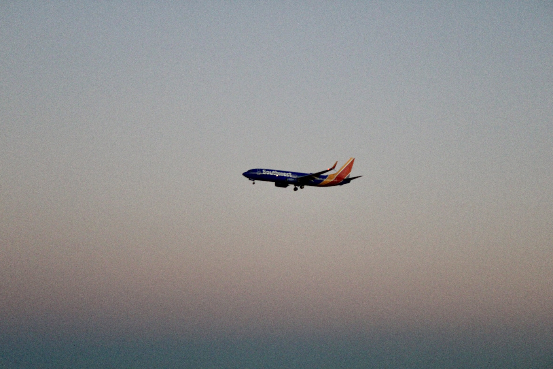Southwest Airlines jet on approach at dusk